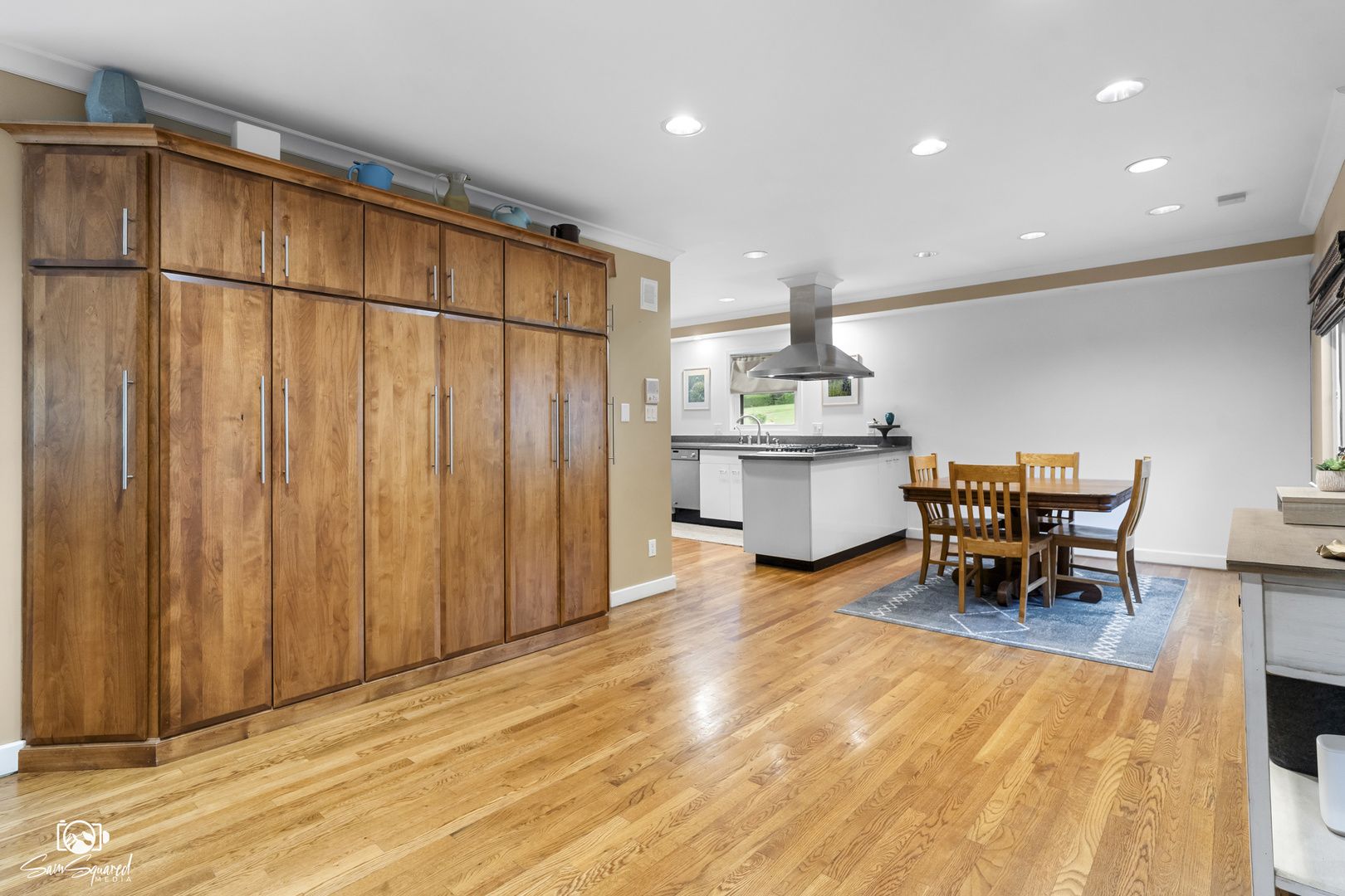 1886 Springview Drive Kankakee, IL 60901 - Photo 13 of 42 a kitchen with stainless steel appliances a dining table chairs and stove top oven