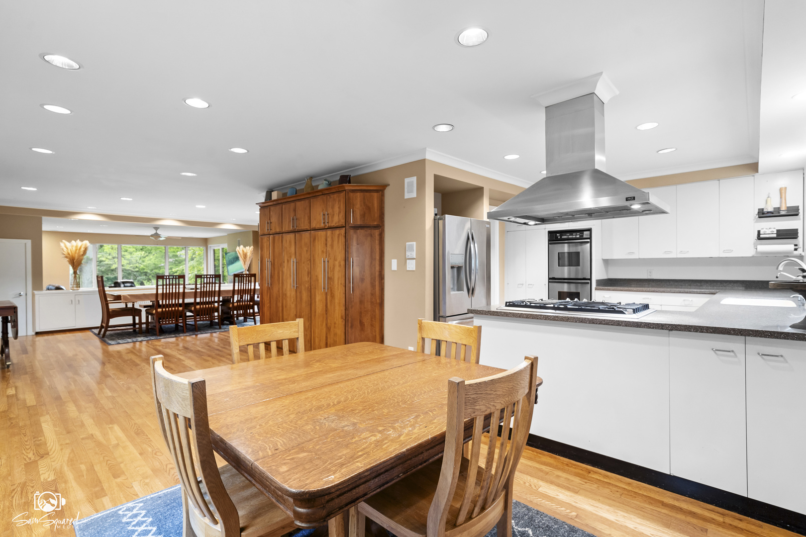 1886 Springview Drive Kankakee, IL 60901 - Photo 16 of 42 a kitchen with stainless steel appliances granite countertop a kitchen island a table and chairs in it