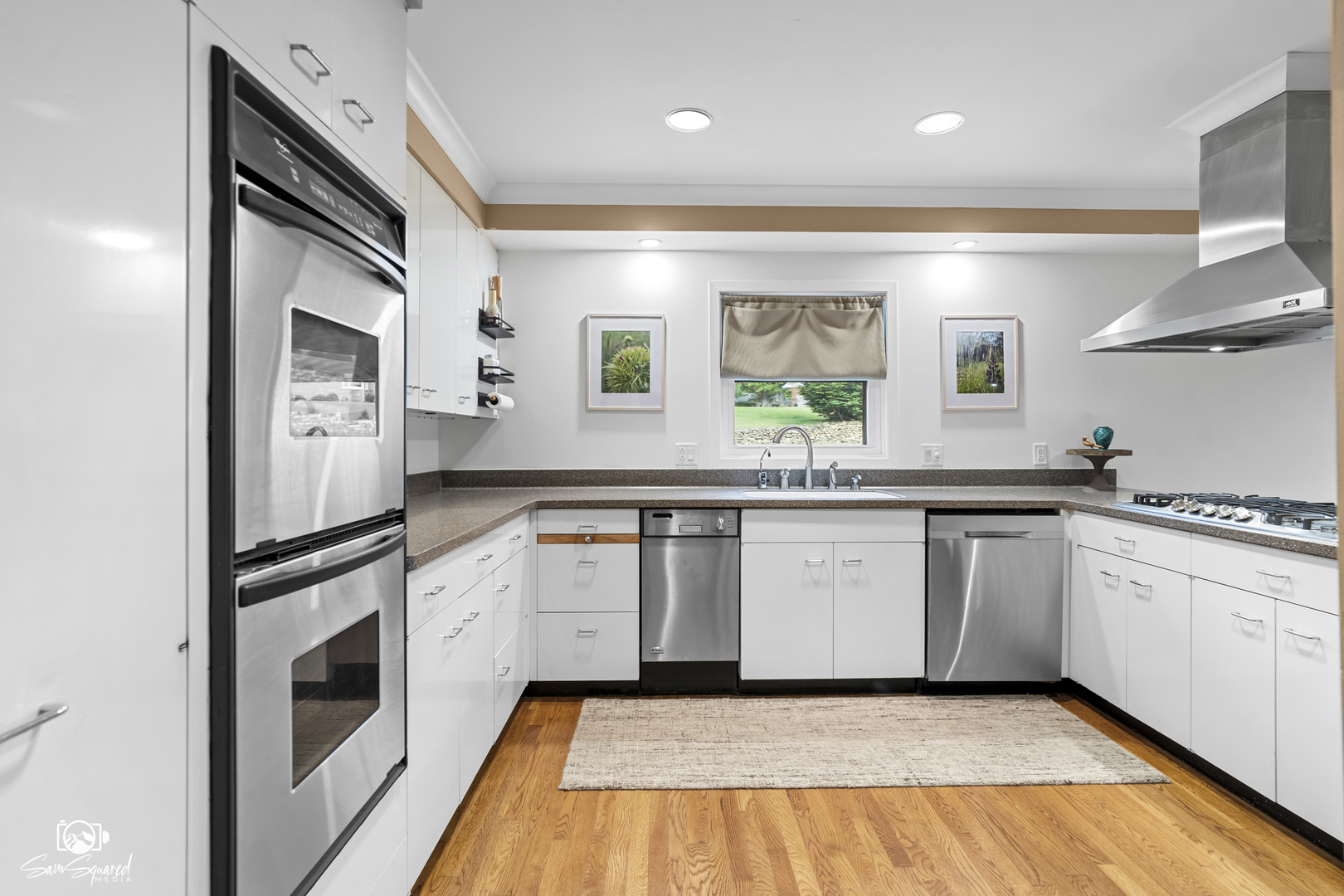 1886 Springview Drive Kankakee, IL 60901 - Photo 19 of 42 a kitchen with stainless steel appliances granite countertop a stove a sink and a refrigerator