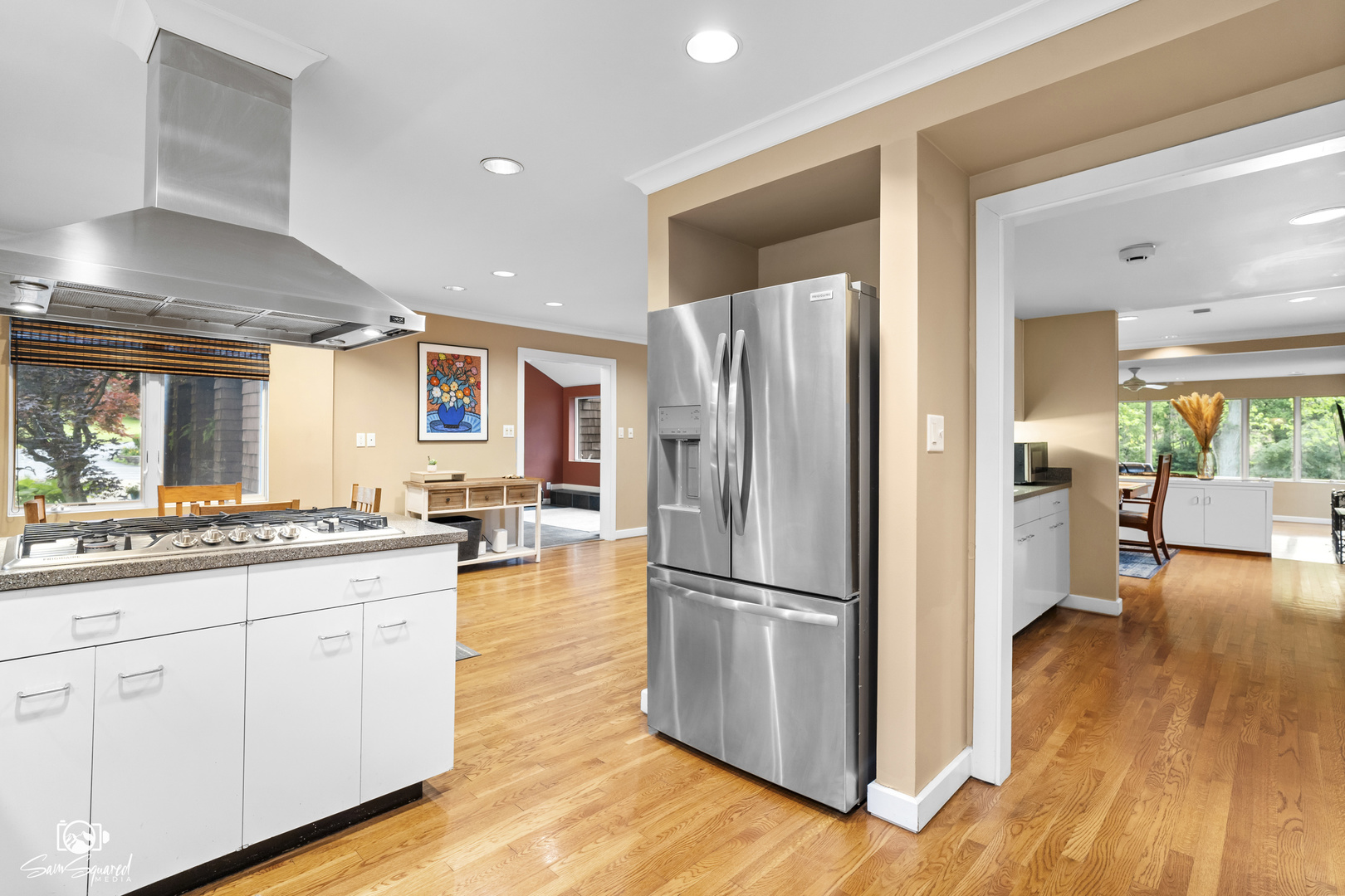 1886 Springview Drive Kankakee, IL 60901 - Photo 20 of 42 a kitchen with stainless steel appliances granite countertop a refrigerator a stove and a wooden floors