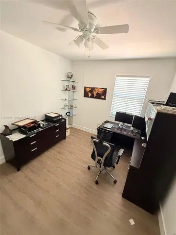 a bedroom with a workspace