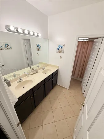 a bathroom with a sink a vanity and a mirror