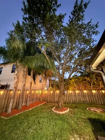 a view of a park with large trees