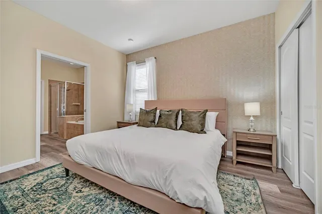 a bedroom with a bed and closet