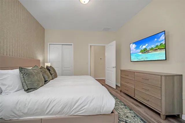 a spacious bathroom with a granite countertop tub a sink and a large mirror