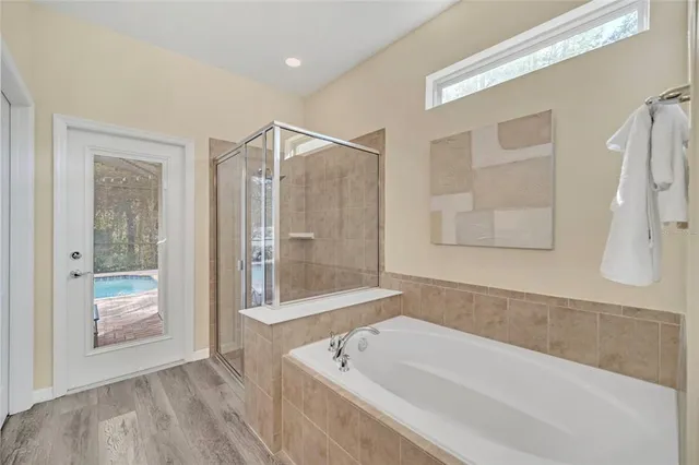 a bedroom with a bed and chair