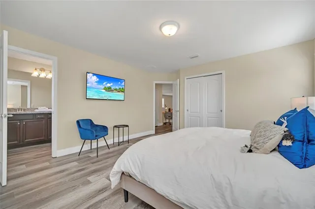 a bathroom with a granite countertop sink a mirror and a shower