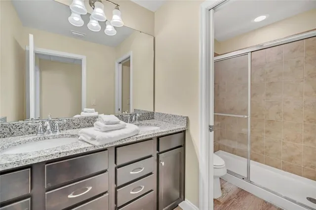 a bedroom with a bed and a lamp