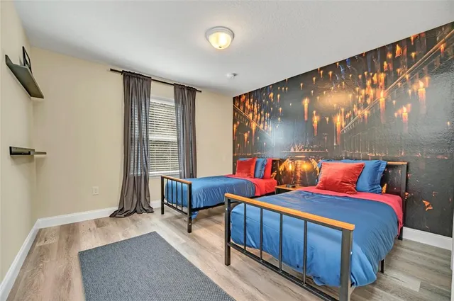 a bedroom with bed and a window