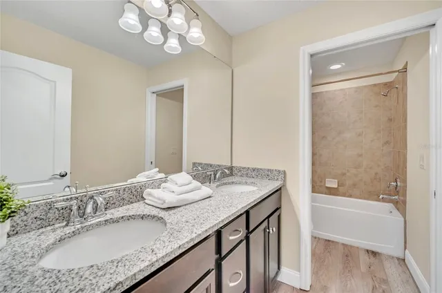 a bathroom with a shower curtain and a bathtub