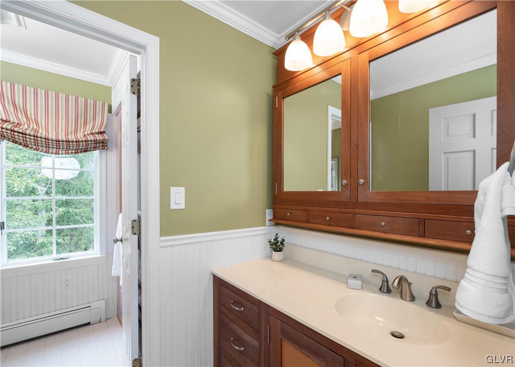 144 Devonshire Drive Stroudsburg, PA 18360 - Photo 29 of 34 a bathroom with a double vanity sink and a mirror