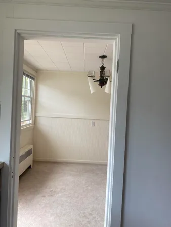 a view of storage and utility room with closet