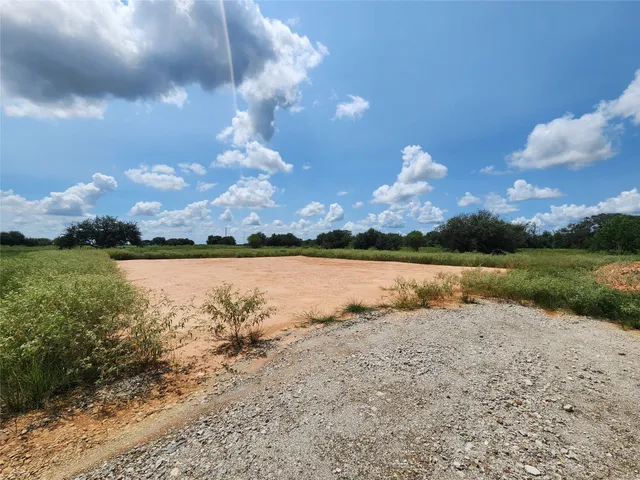 a view of a lake in middle of forest