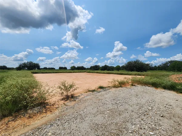 a view of a lake in middle of forest