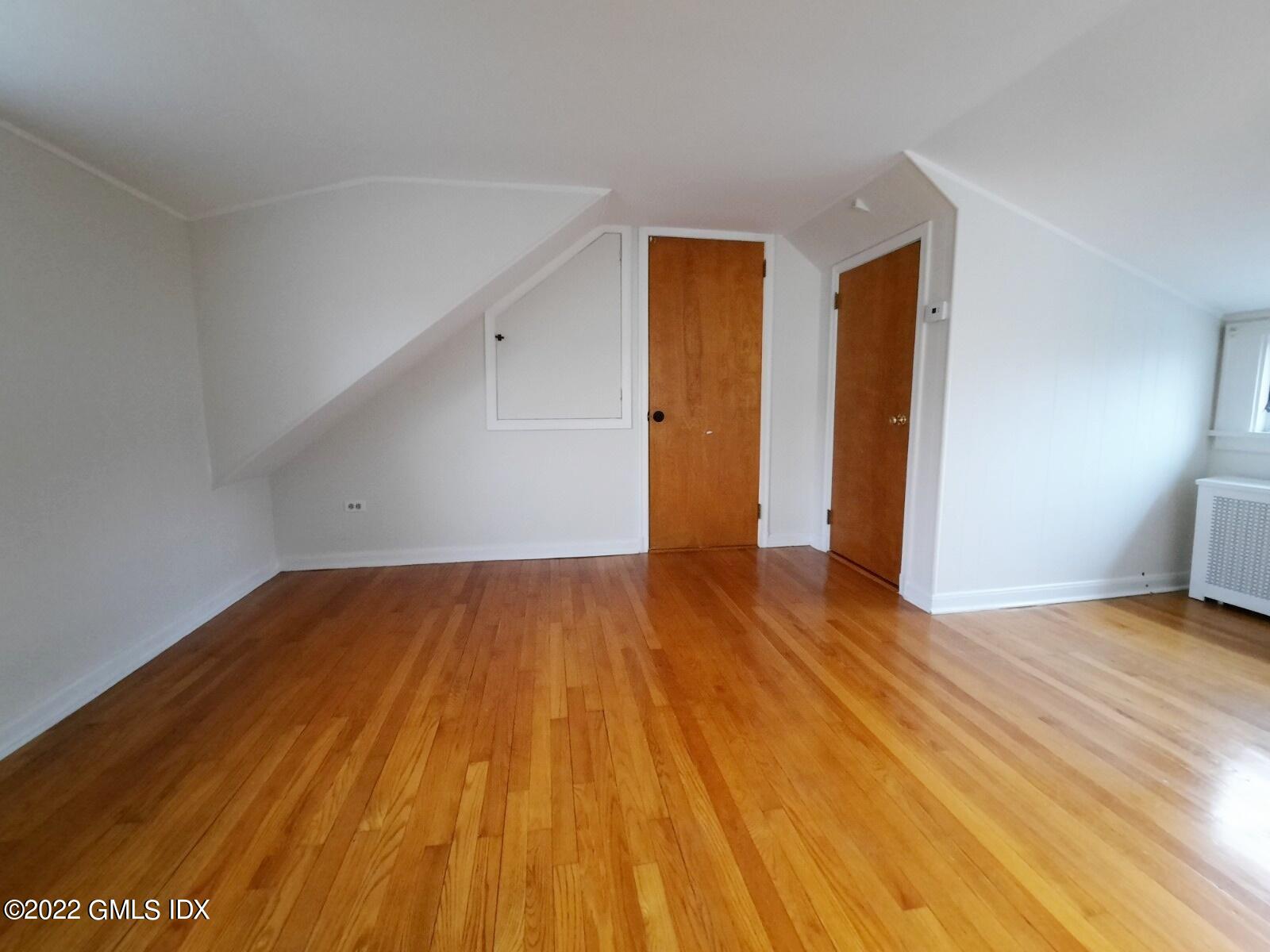 13 High Street Greenwich, CT 06830 - Photo 15 of 21 a view of an empty room and wooden floor