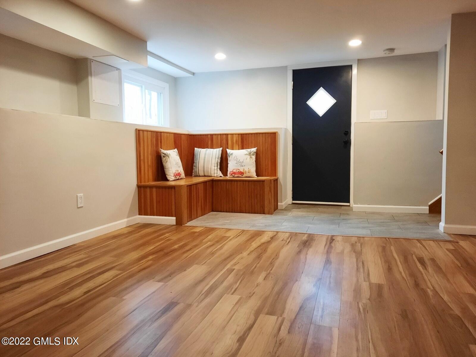 13 High Street Greenwich, CT 06830 - Photo 20 of 21 an empty room with wooden floor and entrance