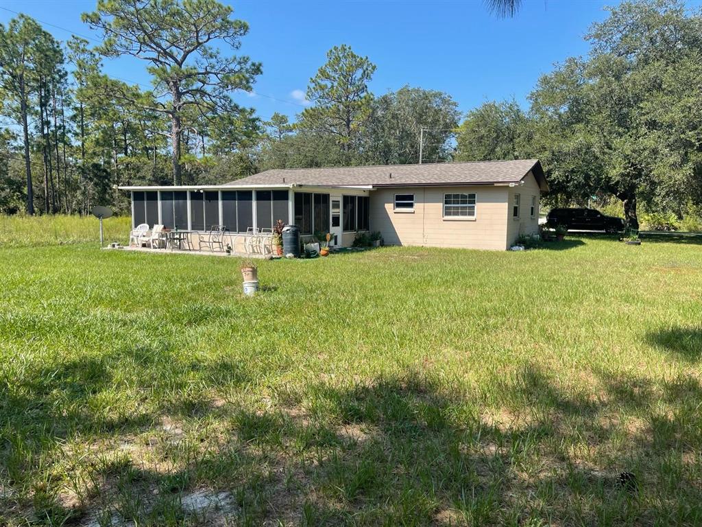 11433 South Rosewater Point Homosassa, FL 34446 - Photo 6 of 7 a view of a house with a yard