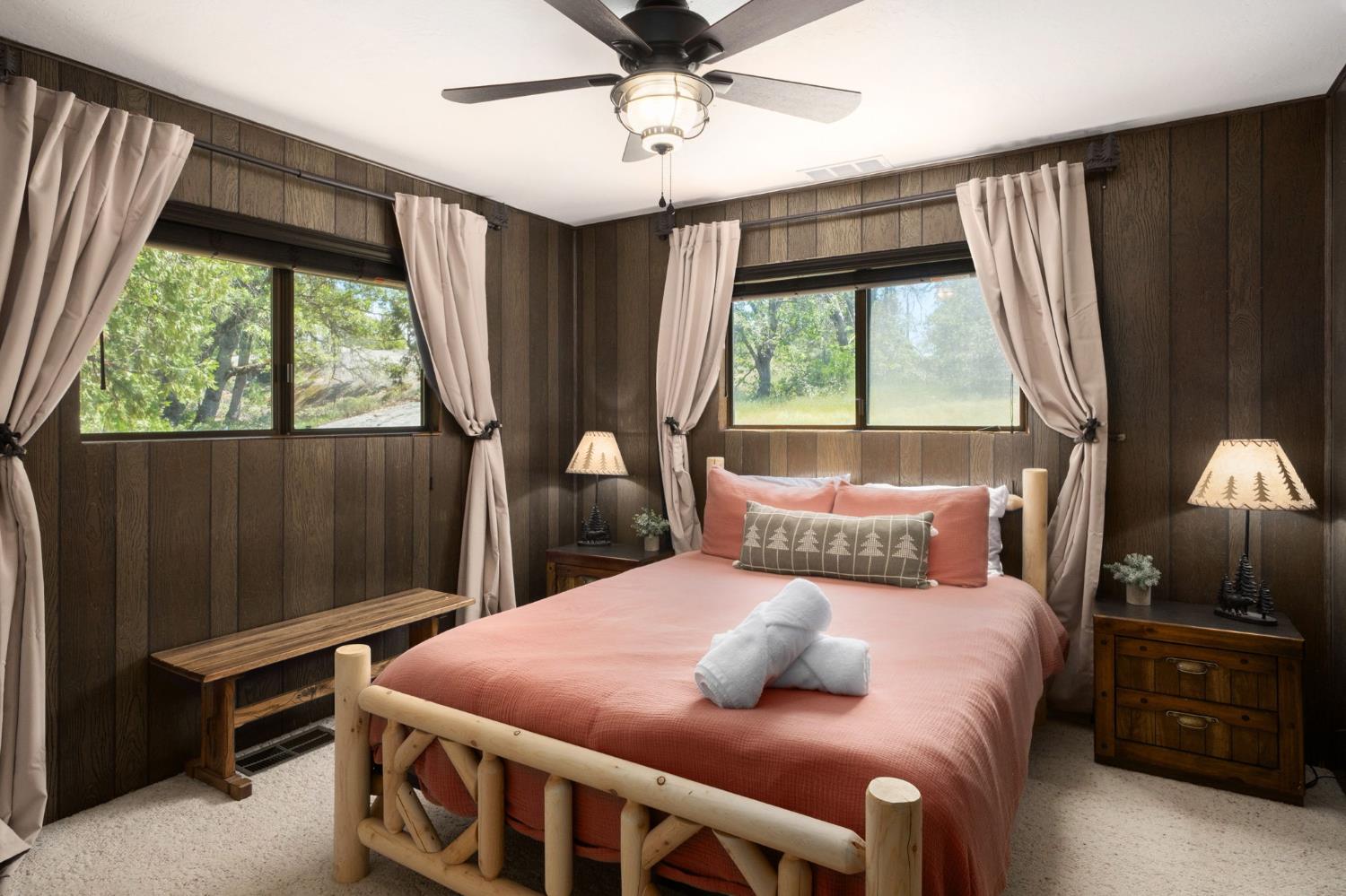 42488 Rock Ledge Road Shaver Lake, CA 93664 - Photo 18 of 26 a bedroom with a bed and a window