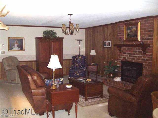 226 Gilliam Road Reidsville, NC 27320 - Photo 2 of 9 Other. Den with FP with woodstove insert