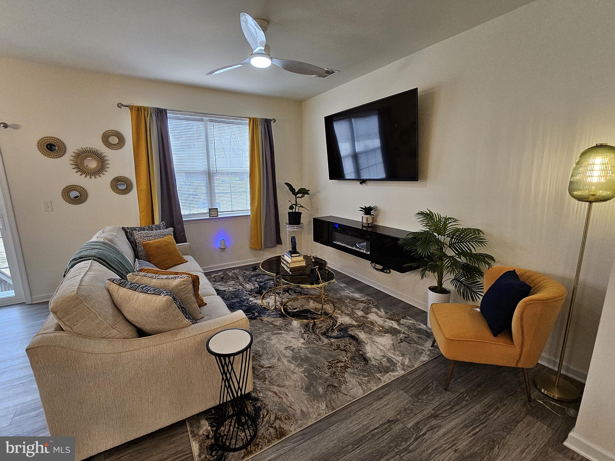 263 Tea Party Trail Dover, DE 19901 - Photo 12 of 36 a living room with furniture and a flat screen tv