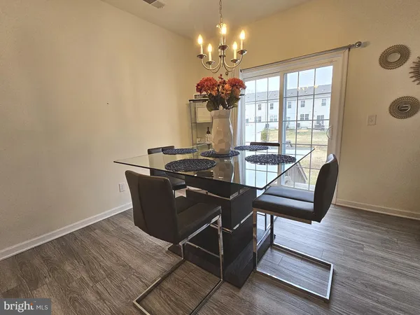 a living room with furniture fireplace and wooden floor