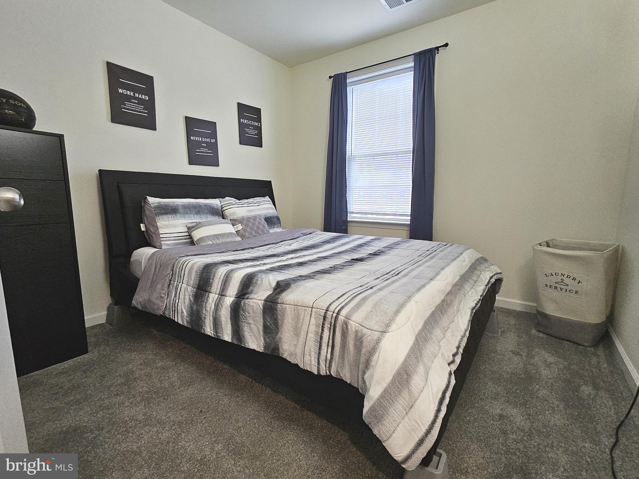 263 Tea Party Trail Dover, DE 19901 - Photo 18 of 36 a bedroom with a bed and a window