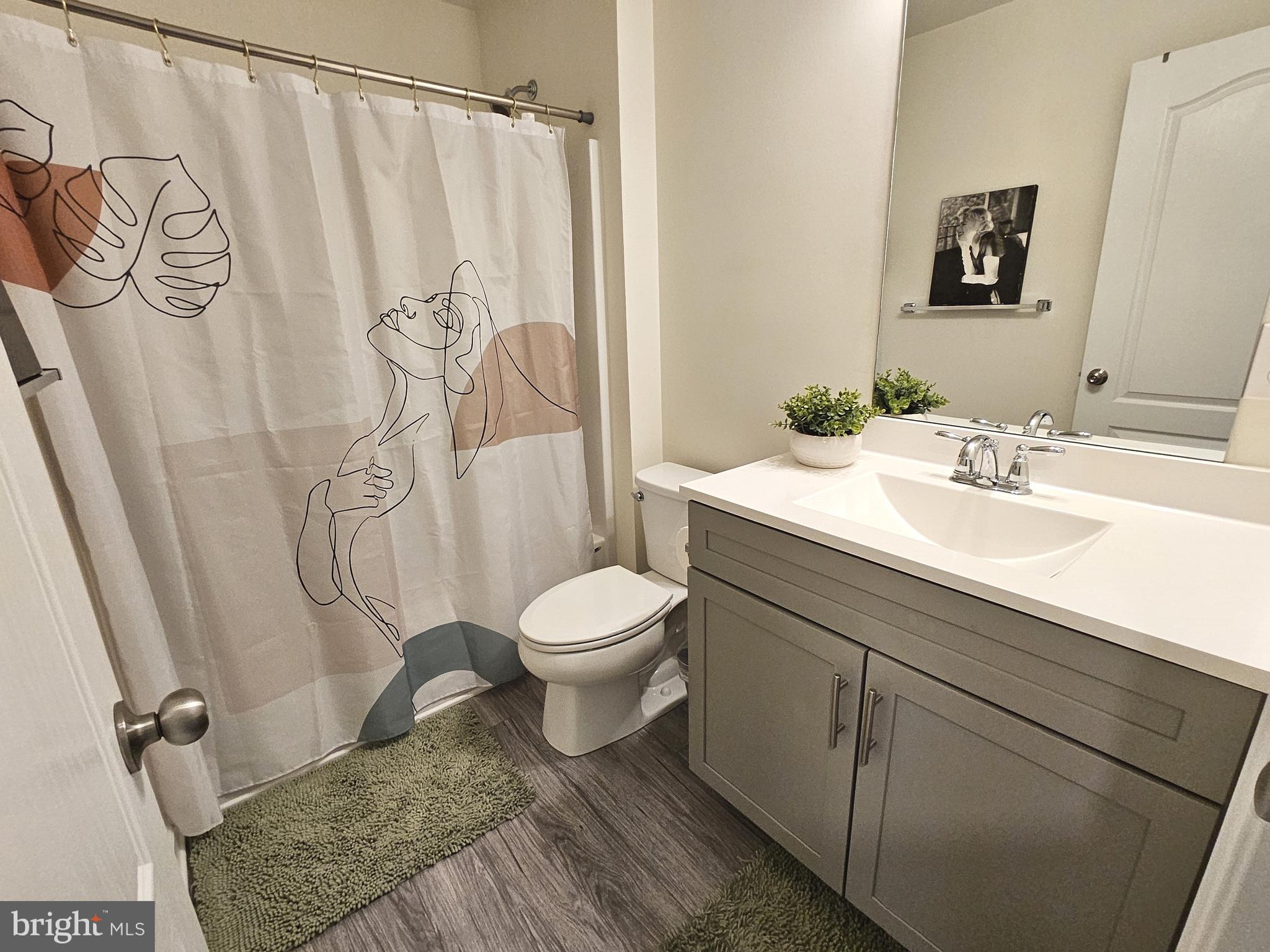 263 Tea Party Trail Dover, DE 19901 - Photo 24 of 36 a bathroom with a toilet sink and shower