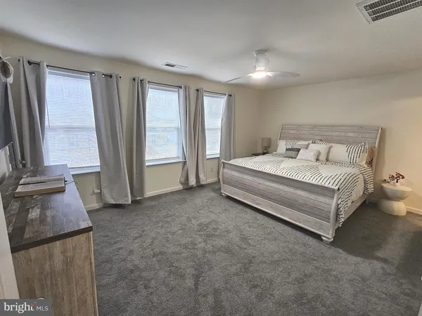 a bathroom with a toilet sink and shower