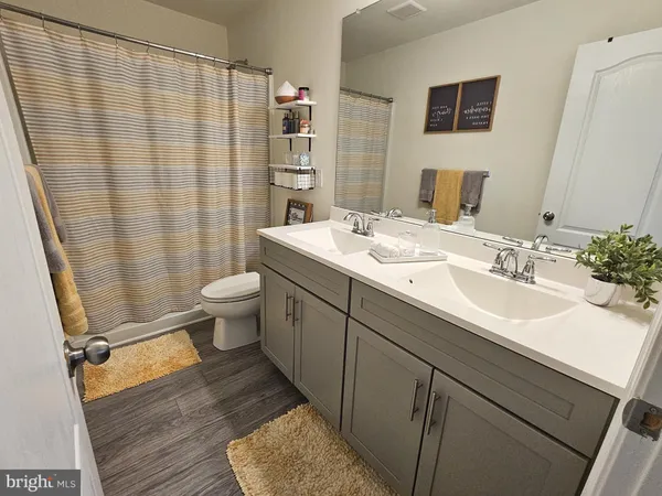 a bedroom with a bed and flat screen tv