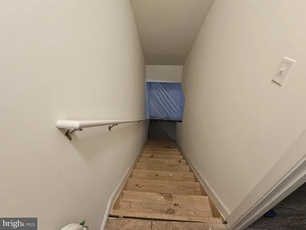 a view of a house with backyard porch and wooden floor