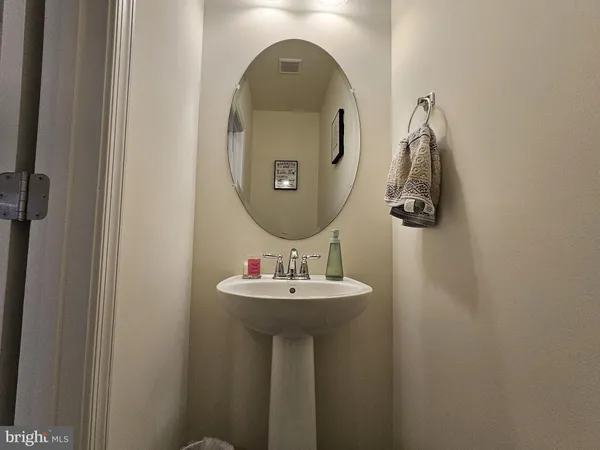 a bathroom with a sink and mirror