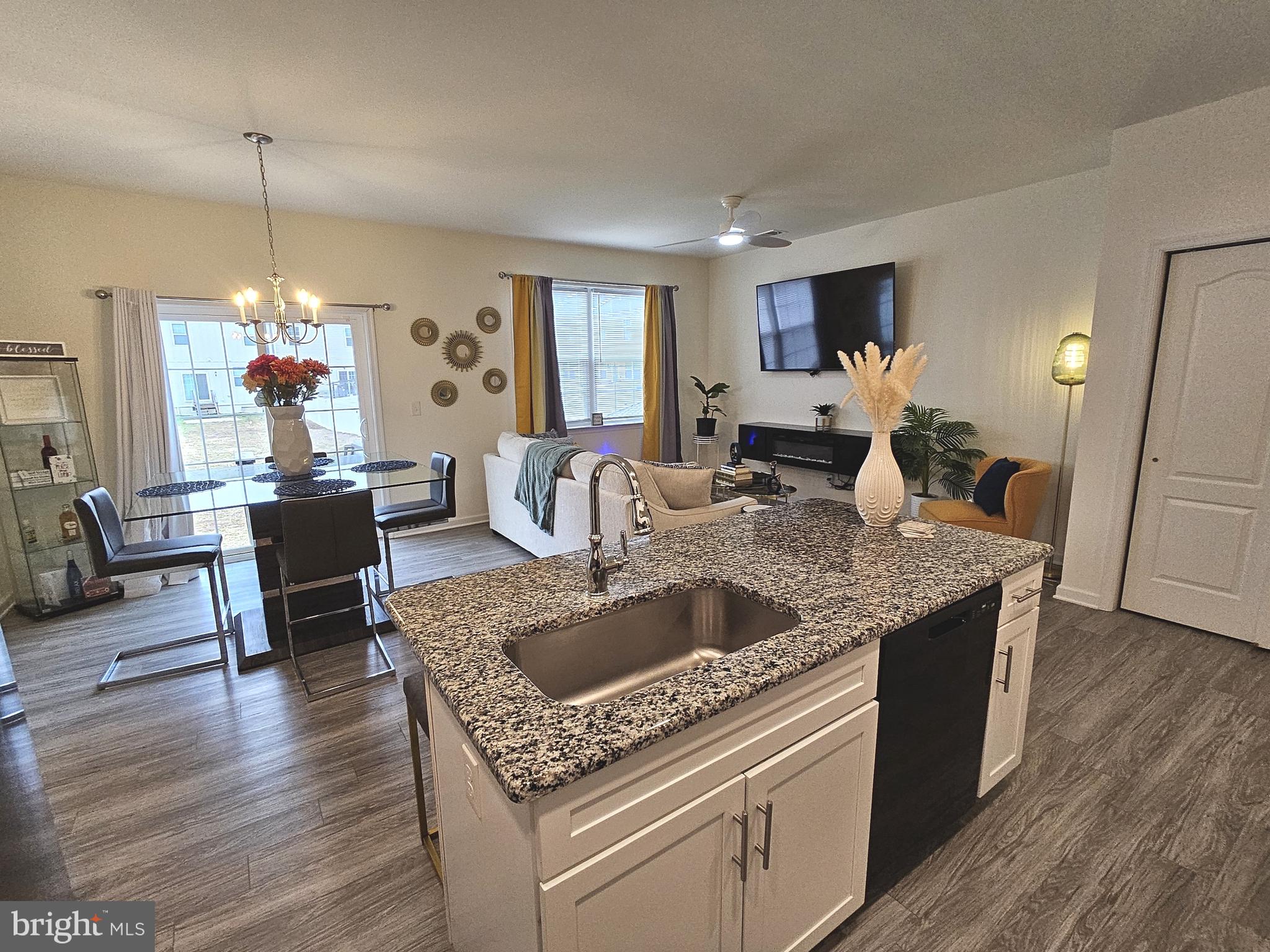 263 Tea Party Trail Dover, DE 19901 - Photo 9 of 36 a view of kitchen island with granite countertop living room