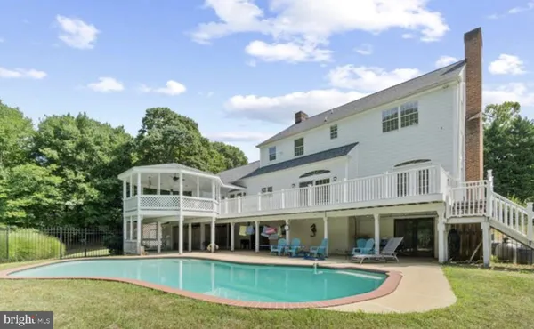 a front view of a house with swimming pool