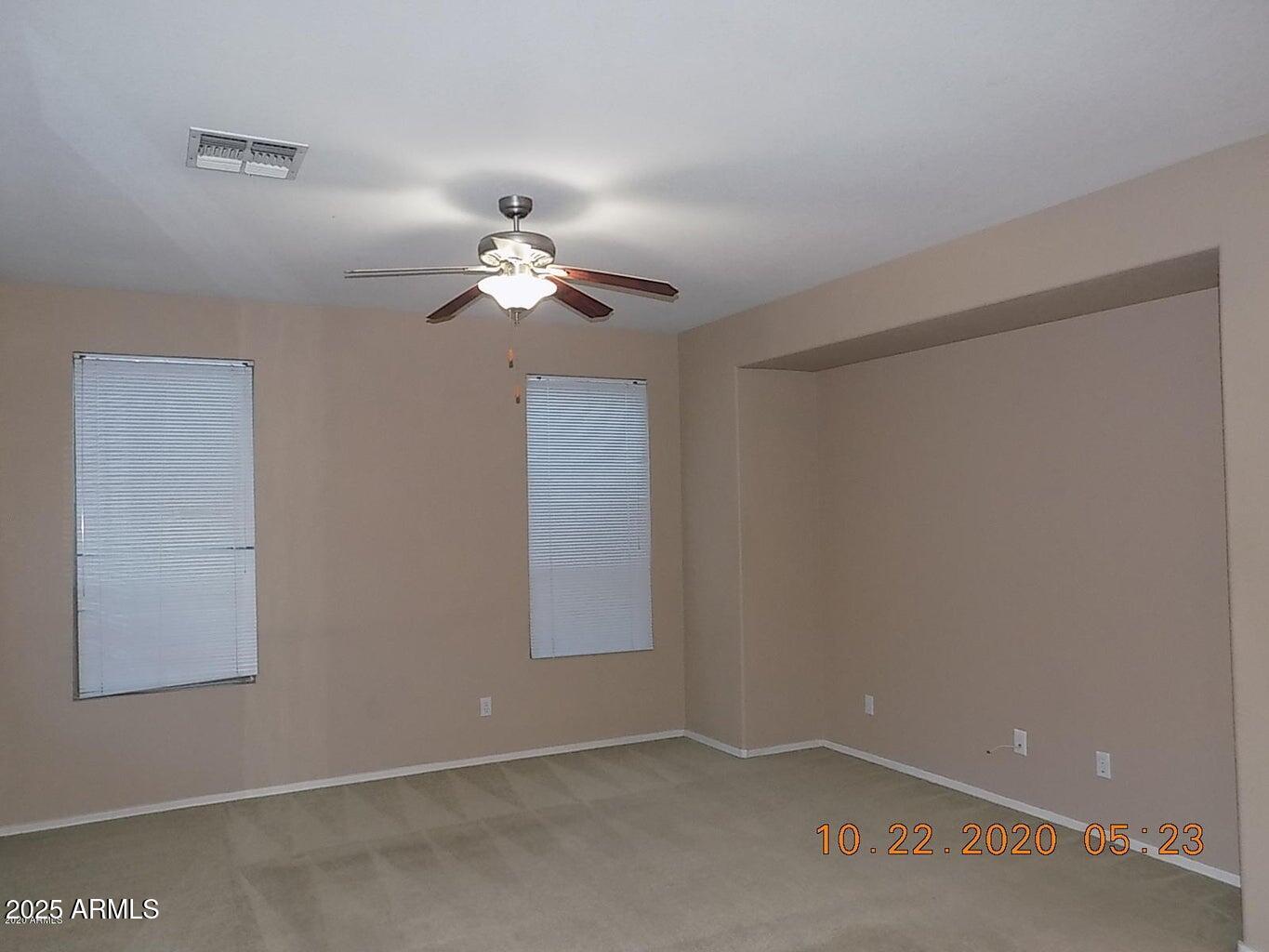 5337 East Harmony Avenue Mesa, AZ 85206 - Photo 12 of 27 a view of an empty room with a fan