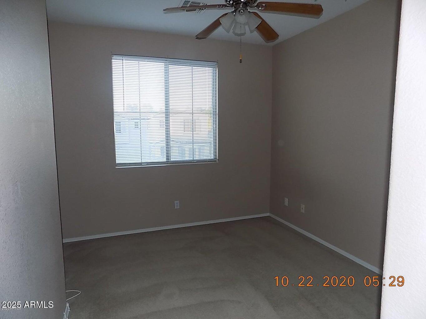 5337 East Harmony Avenue Mesa, AZ 85206 - Photo 14 of 27 an empty room with a window