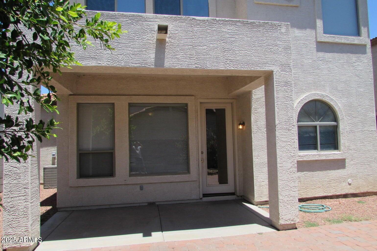 5337 East Harmony Avenue Mesa, AZ 85206 - Photo 23 of 27 a front view of a house with a