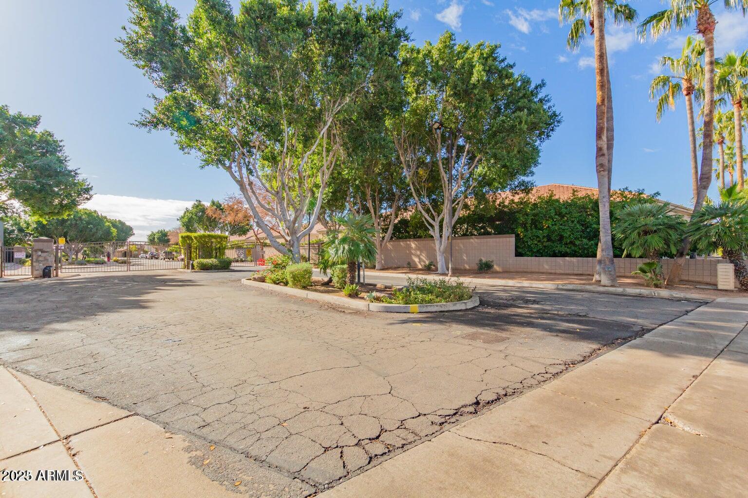 5337 East Harmony Avenue Mesa, AZ 85206 - Photo 25 of 27 a view of a street with houses on both side