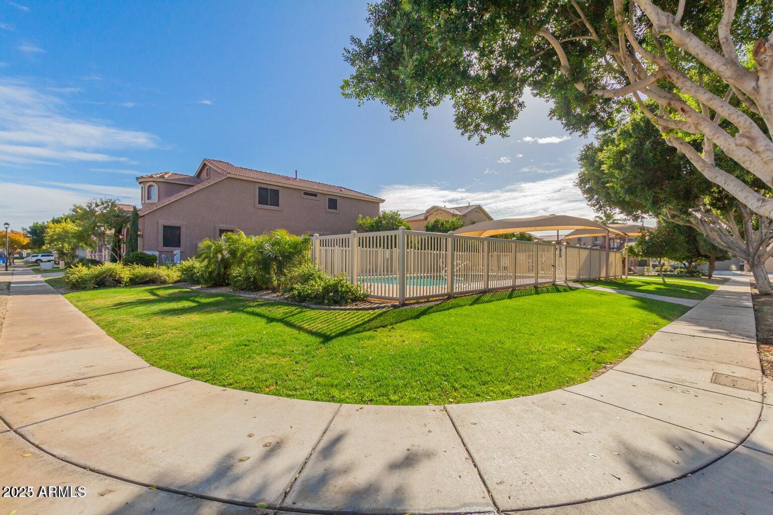 5337 East Harmony Avenue Mesa, AZ 85206 - Photo 26 of 27 front view of a house with a yard