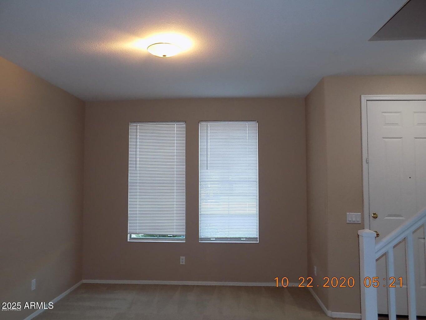 5337 East Harmony Avenue Mesa, AZ 85206 - Photo 9 of 27 an empty room with a window