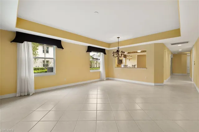 a view of a hallway with a chandelier