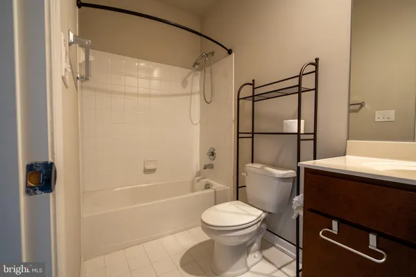 a bathroom with a toilet a sink and shower