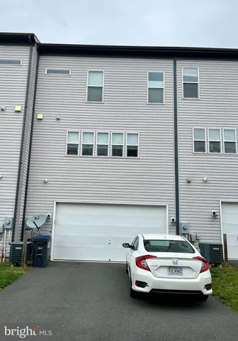 a car parked in front of a house