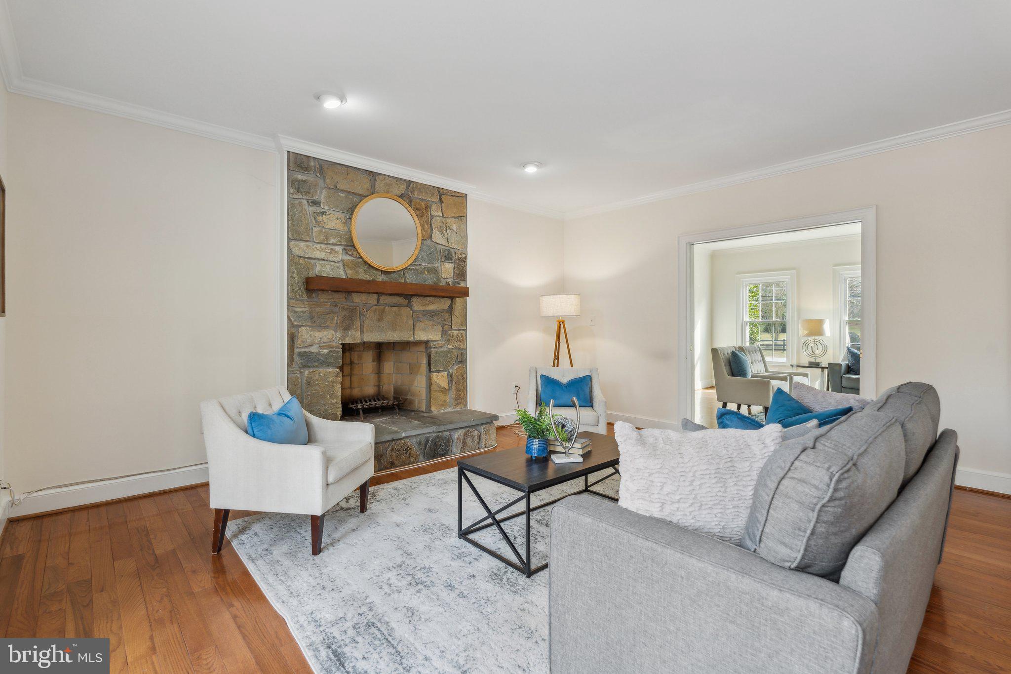 7708 Brickyard Road Potomac, MD 20854 - Photo 8 of 45 Wood-burning fireplace with stone hearth