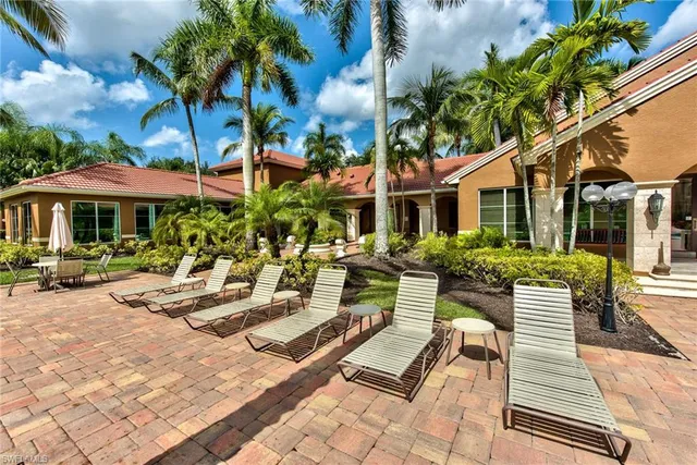 a view of a patio with chairs and tables