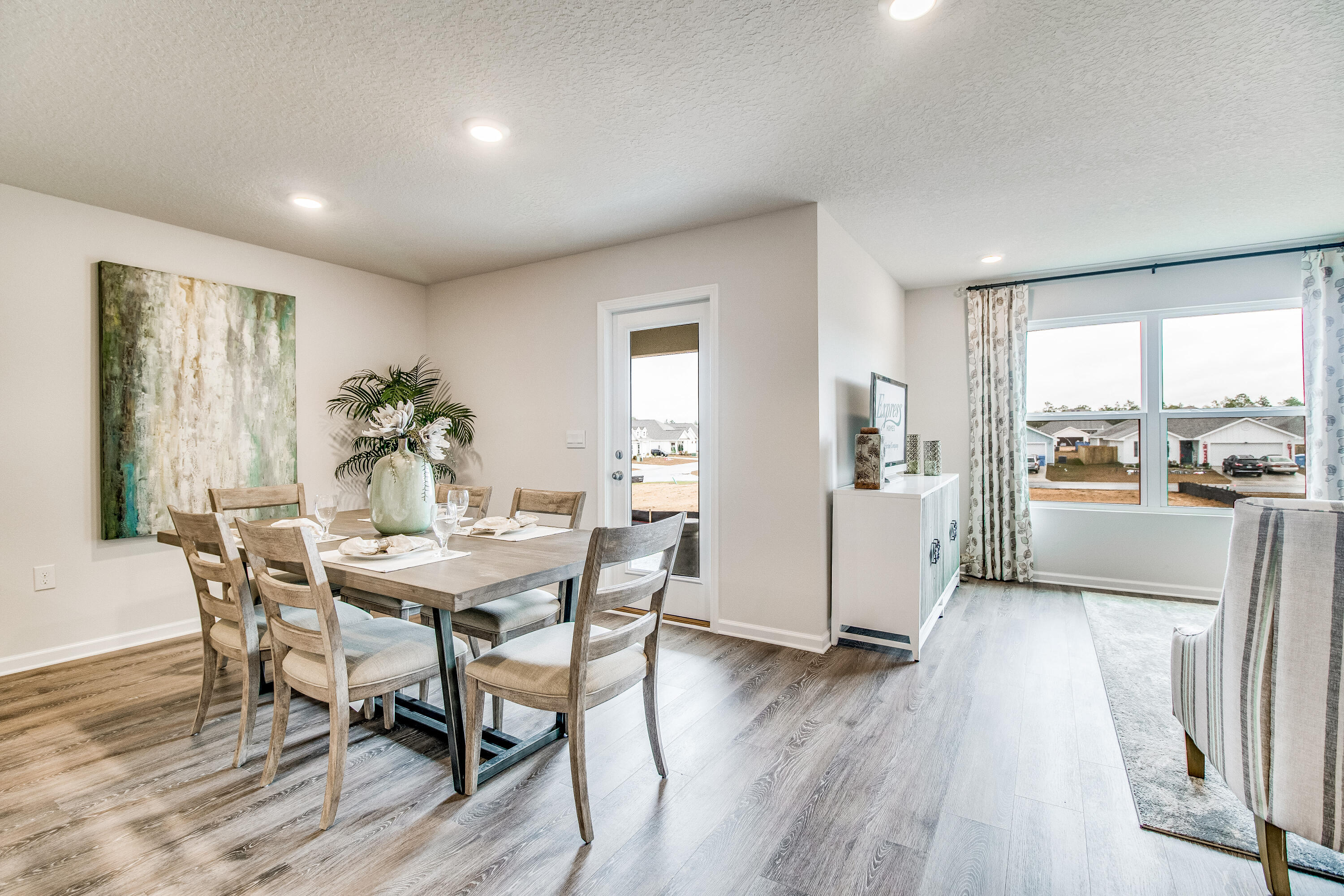 3111 Van Day Way Crestview, FL 32539 - Photo 5 of 24 a view of a dining room with furniture and wooden floor