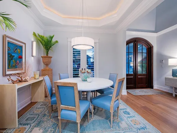 a dining room with furniture and a fireplace