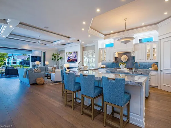 a kitchen with a table and chairs