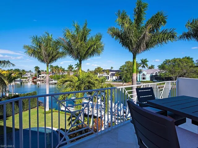 a view of swimming pool with outdoor seating and a patio