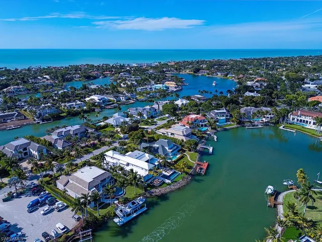 an aerial view of a house with a lake view