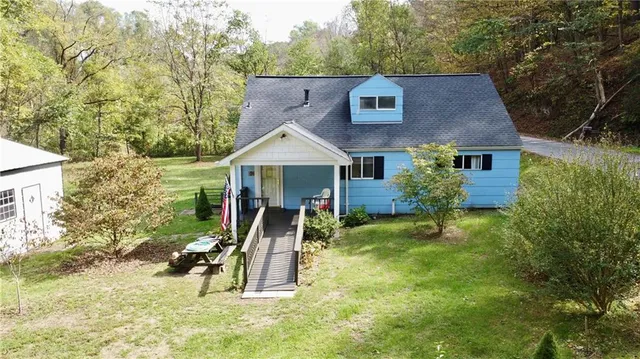 front view of a house with a yard